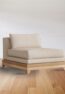 Modern wooden sofa with beige cushions, handcrafted from solid wood with a minimalist Scandinavian design.