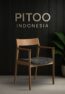 SF24 dining armchair made from teak wood with black textured seat by PITOO Jepara