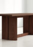 Close-up detail of the tapered tabletop and teak wood grain on the AUREN Dining Table.