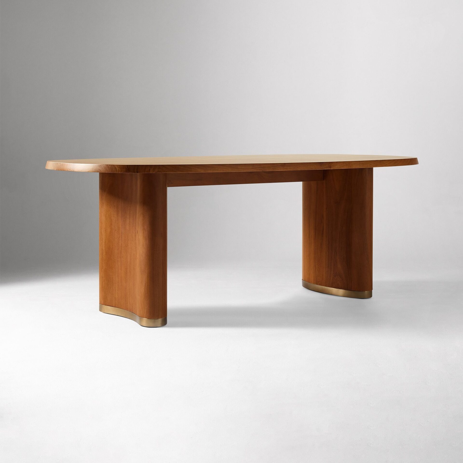 ALDERA solid teak oval dining table handcrafted in Jepara with rounded corners and sculptural legs.