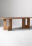 LUMORA solid teak wood dining table handcrafted in Jepara with architectural cut-out panel legs.