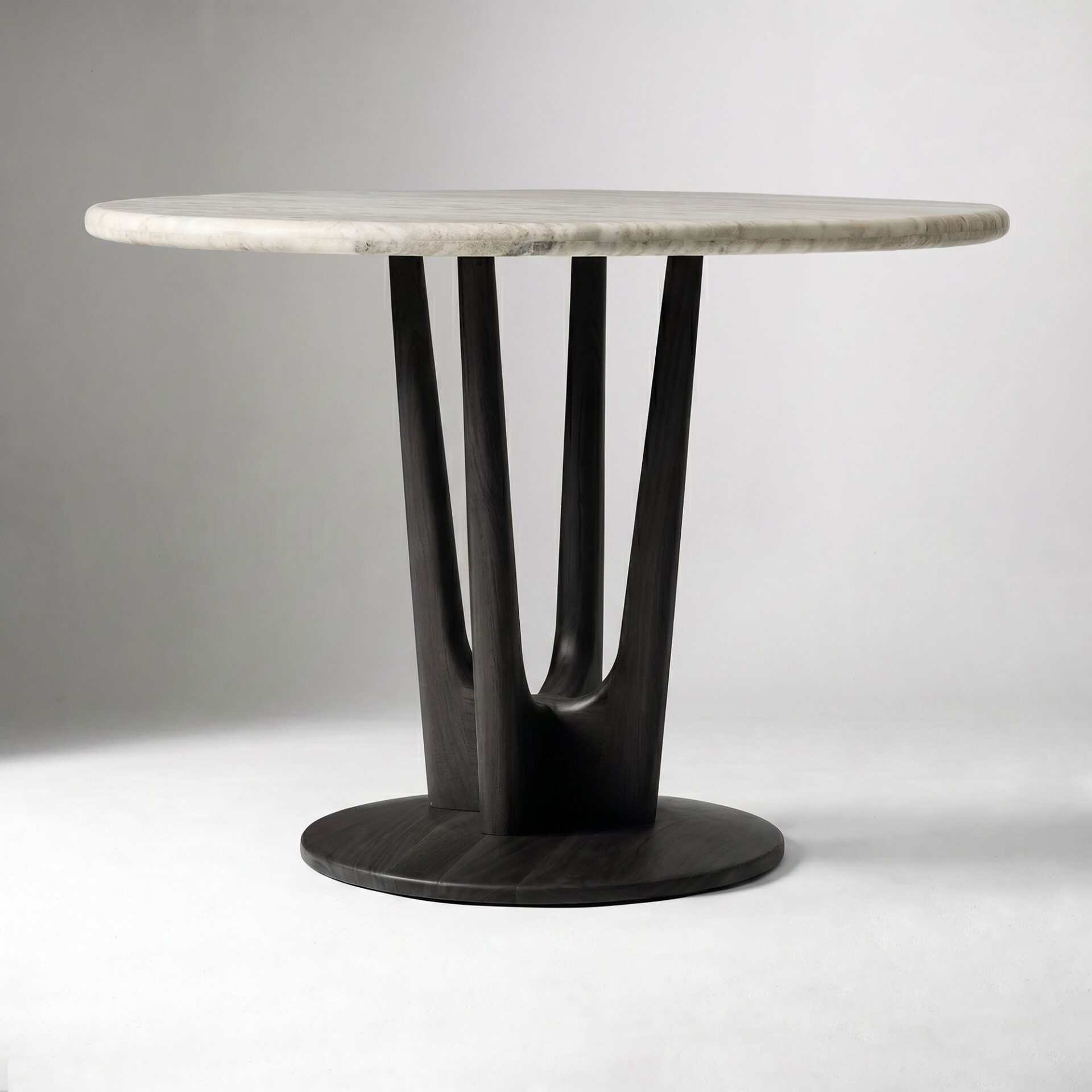 LUNARA marble top bistro table handcrafted in Jepara with a natural marble surface and sculptural teak wood base.