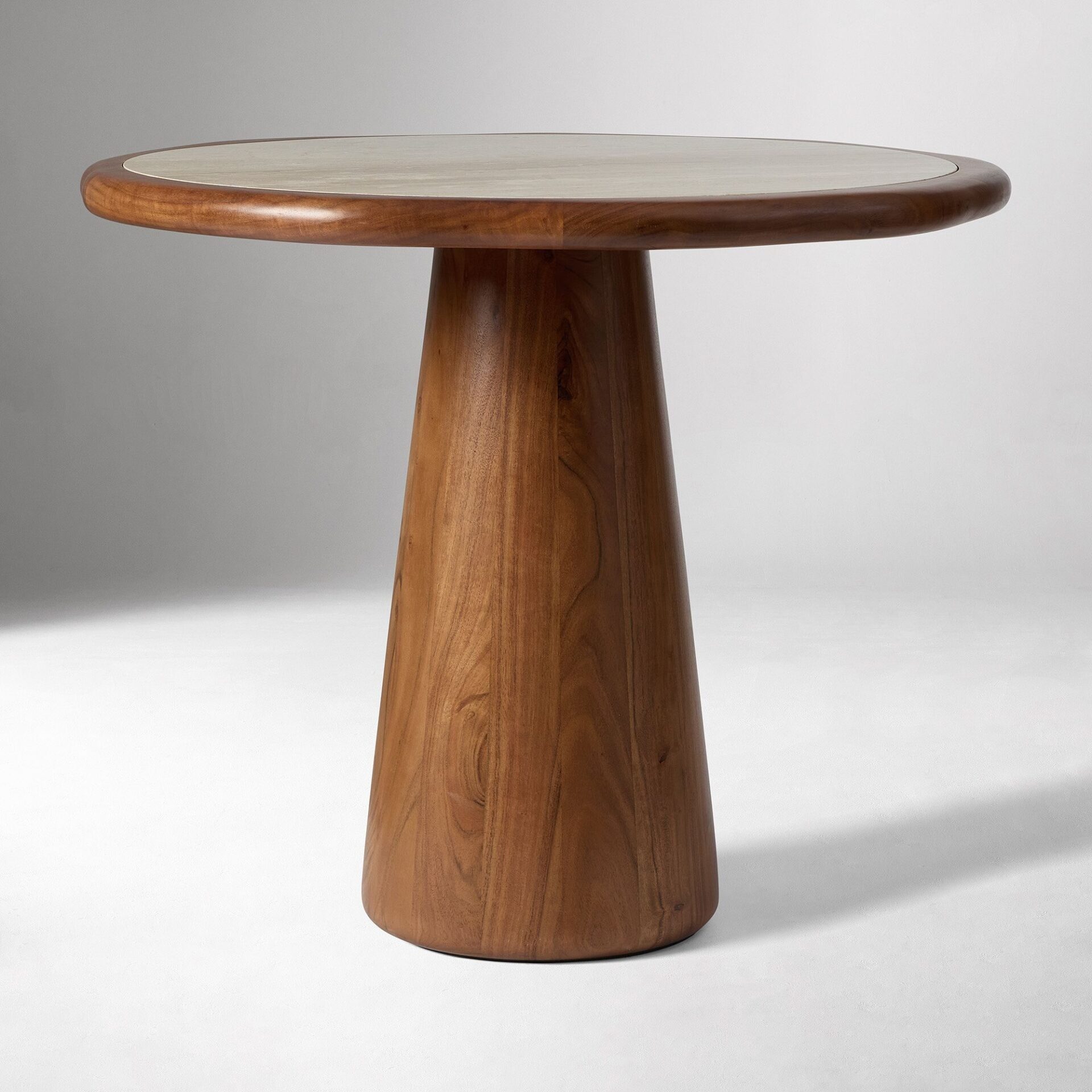 MIREL marble top bistro table handcrafted in Jepara with a sculptural solid wood base.