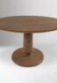 ORBELLE solid teak round dining table handcrafted in Jepara with a sculptural pedestal base.