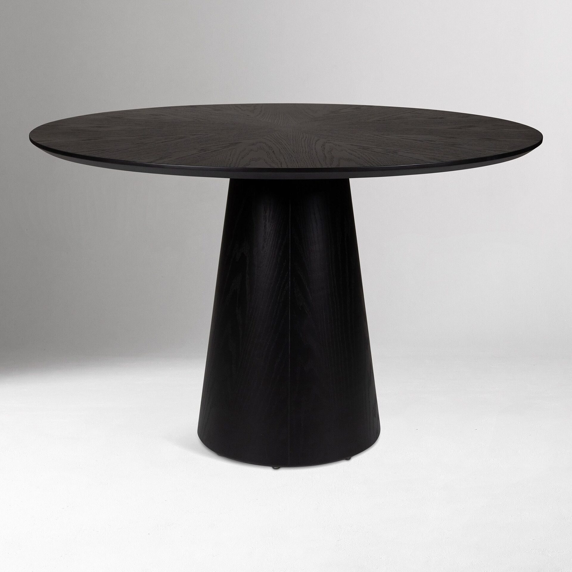 ORVIA solid teak round dining table handcrafted in Jepara with a sculptural pedestal base.